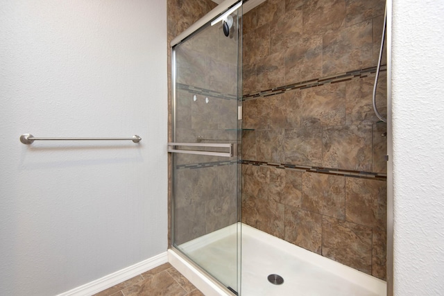 5048 S Fieldstone Rd, Battlefield, MO 65619 - full bath featuring a tile shower and baseboards