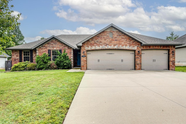 5048 S Fieldstone Rd, Battlefield, MO 65619 - ranch-style house featuring brick siding, an attached garage, driveway, roof with shingles, and a front yard