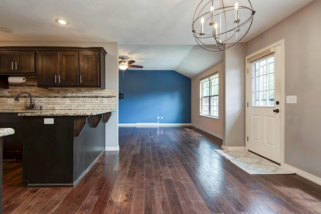 5048 S Fieldstone Rd, Battlefield, MO 65619 - kitchen with dark brown cabinets, a ceiling fan, dark wood finished floors, baseboards, and vaulted ceiling