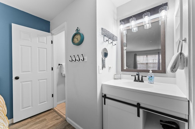 200 Golf View Dr Unit 3, Branson, MO 65616 - bathroom with vanity, wood finished floors, and baseboards