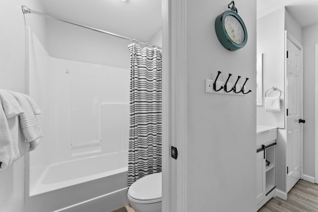 200 Golf View Dr Unit 3, Branson, MO 65616 - bathroom with toilet, shower / bath combo with shower curtain, vanity, wood finished floors, and baseboards