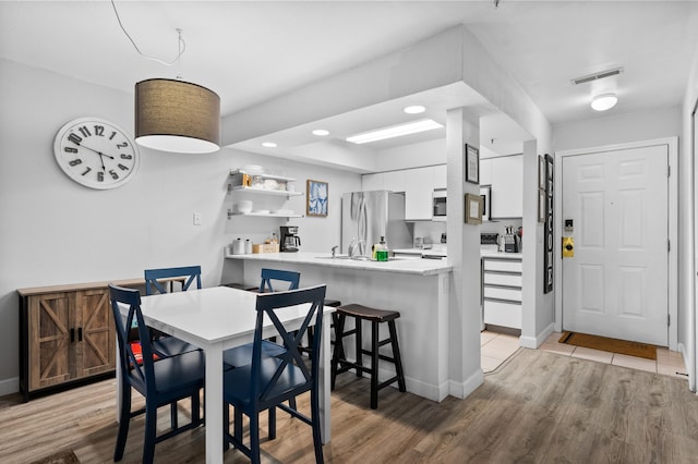 200 Golf View Dr Unit 3, Branson, MO 65616 - dining room with light wood-style floors, baseboards, and recessed lighting