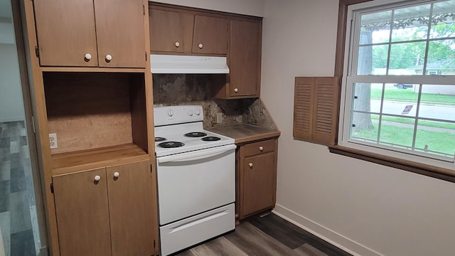 415 N Locust St, Marshfield, MO 65706 - kitchen featuring white range with electric cooktop, under cabinet range hood, dark wood-type flooring, and baseboards