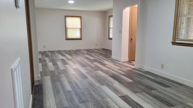 415 N Locust St, Marshfield, MO 65706 - unfurnished room with wood finished floors and baseboards
