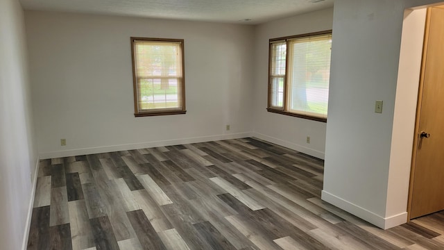 415 N Locust St, Marshfield, MO 65706 - spare room with dark wood finished floors and baseboards