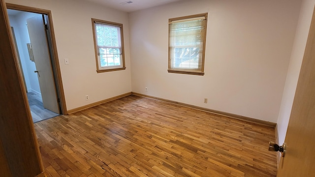 415 N Locust St, Marshfield, MO 65706 - unfurnished bedroom featuring light wood-type flooring and baseboards