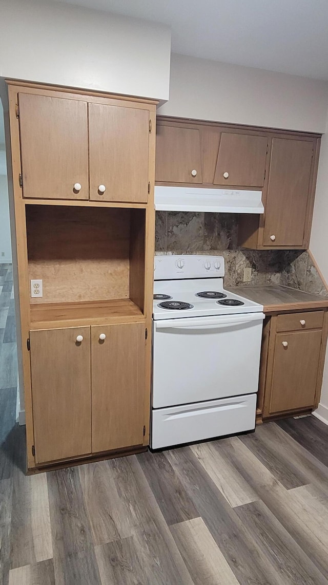415 N Locust St, Marshfield, MO 65706 - kitchen featuring white range with electric cooktop, dark wood-style flooring, and under cabinet range hood