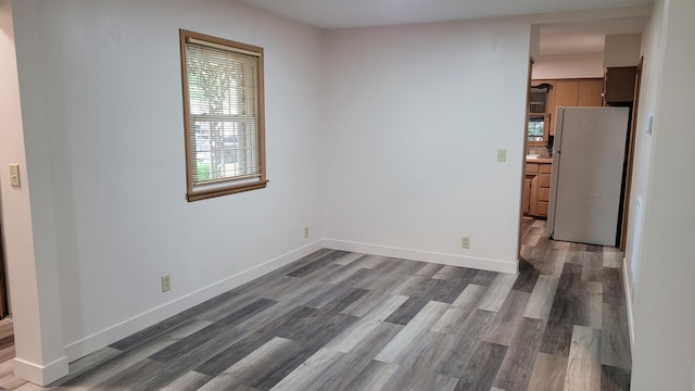 415 N Locust St, Marshfield, MO 65706 - unfurnished room featuring wood finished floors and baseboards