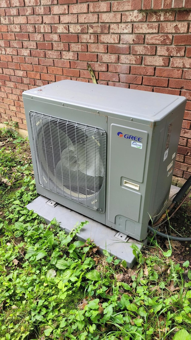 415 N Locust St, Marshfield, MO 65706 - exterior view of ac unit and brick siding