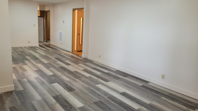 415 N Locust St, Marshfield, MO 65706 - unfurnished room featuring wood finished floors and baseboards