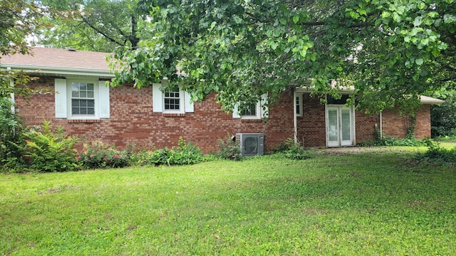 415 N Locust St, Marshfield, MO 65706 - view of side of property with a yard, a cooling unit, and brick siding