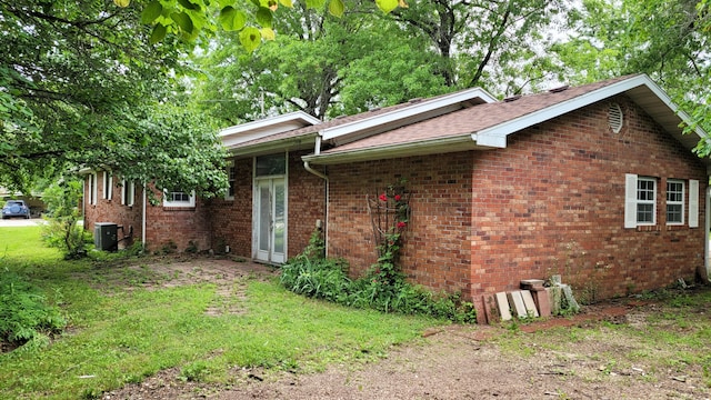 415 N Locust St, Marshfield, MO 65706 - view of side of home featuring central AC and brick siding