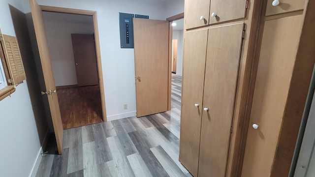 415 N Locust St, Marshfield, MO 65706 - corridor featuring wood finished floors, baseboards, and electric panel