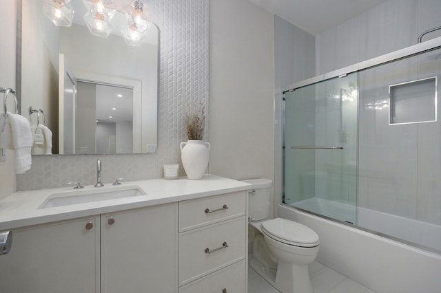 3725 E Woodhue St, Springfield, MO 65802 - bathroom with toilet, vanity, enclosed tub / shower combo, and tile patterned flooring