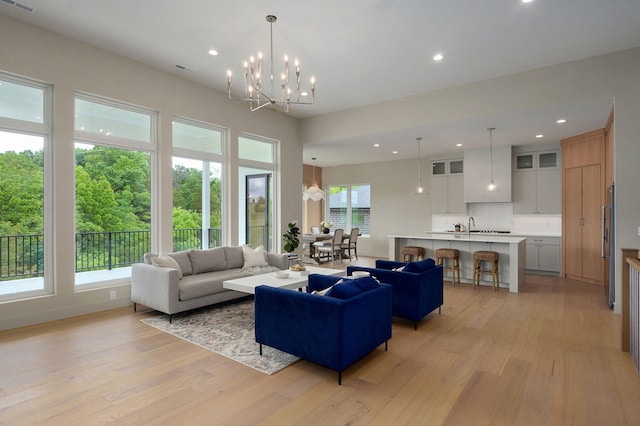 3725 E Woodhue St, Springfield, MO 65802 - living room with light wood-style flooring, recessed lighting, and a chandelier