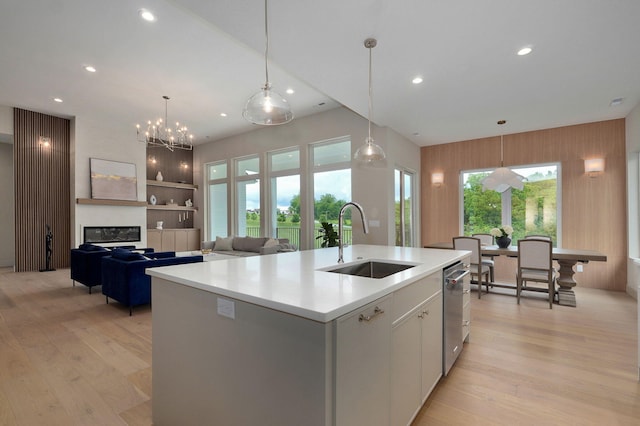 3725 E Woodhue St, Springfield, MO 65802 - kitchen with a sink, a kitchen island with sink, light wood-style floors, white cabinets, and recessed lighting