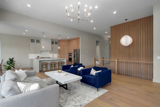 3725 E Woodhue St, Springfield, MO 65802 - living room featuring light wood-style floors, recessed lighting, and a chandelier