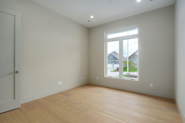 3725 E Woodhue St, Springfield, MO 65802 - empty room with light wood-style floors, baseboards, and recessed lighting
