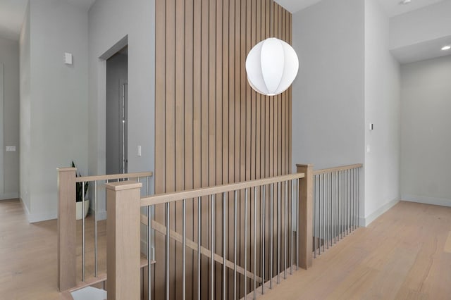 3725 E Woodhue St, Springfield, MO 65802 - corridor featuring an upstairs landing, wood finished floors, and baseboards