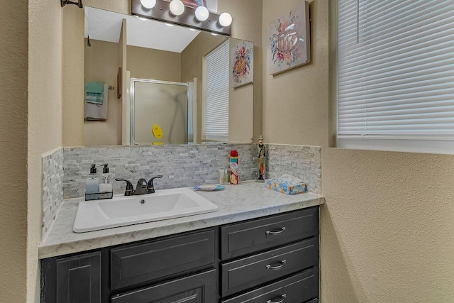 360 Cathy St, Branson, MO 65616 - bathroom with vanity, tasteful backsplash, a stall shower, and a textured wall