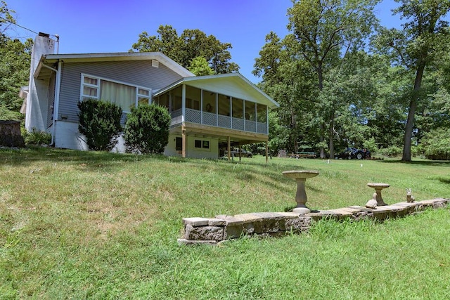 360 Cathy St, Branson, MO 65616 - back of house with a sunroom, a chimney, and a yard