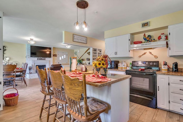 360 Cathy St, Branson, MO 65616 - kitchen featuring black electric range oven, ventilation hood, light wood-style flooring, and white cabinets