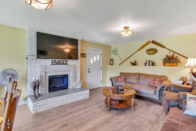 360 Cathy St, Branson, MO 65616 - living room with wood finished floors and a fireplace