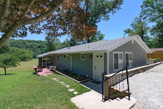 360 Cathy St, Branson, MO 65616 - back of property with a patio area, a lawn, and roof with shingles