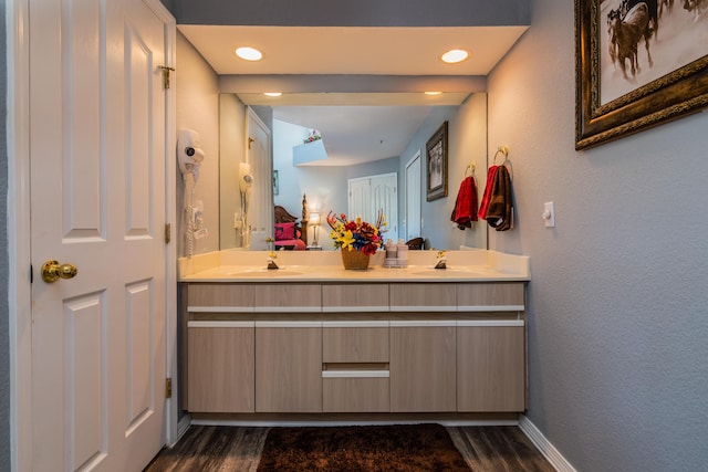 79 Anglers Pointe Dr Unit 5, Branson, MO 65616 - full bathroom with wood finished floors, double vanity, and baseboards