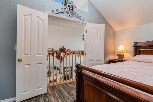 79 Anglers Pointe Dr Unit 5, Branson, MO 65616 - bedroom with lofted ceiling and dark wood-style floors