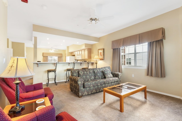 2800 Green Mountain Dr Unit 331, Branson, MO 65616 - living room featuring a ceiling fan, light colored carpet, and baseboards