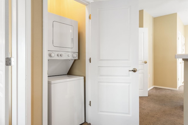 2800 Green Mountain Dr Unit 331, Branson, MO 65616 - laundry area with stacked washing machine and dryer and carpet flooring