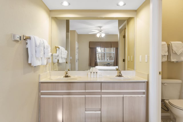 2800 Green Mountain Dr Unit 331, Branson, MO 65616 - bathroom with toilet, double vanity, and ceiling fan