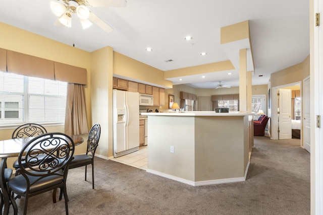 2800 Green Mountain Dr Unit 331, Branson, MO 65616 - kitchen with white appliances, ceiling fan, light carpet, healthy amount of natural light, and recessed lighting