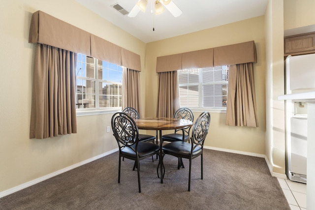 2800 Green Mountain Dr Unit 331, Branson, MO 65616 - dining space featuring a ceiling fan, baseboards, and carpet flooring
