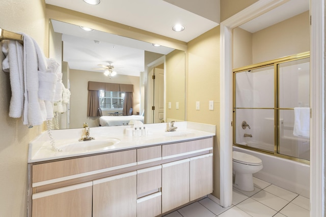 2800 Green Mountain Dr Unit 331, Branson, MO 65616 - bathroom with connected bathroom, double vanity, toilet, shower / bath combination with glass door, and ceiling fan