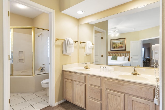 2800 Green Mountain Dr Unit 331, Branson, MO 65616 - full bathroom featuring connected bathroom, toilet, double vanity, shower / bath combination with glass door, and a ceiling fan