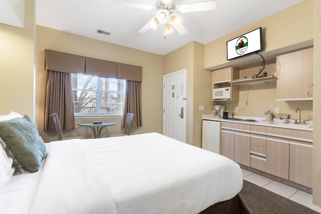 2800 Green Mountain Dr Unit 331, Branson, MO 65616 - bedroom with a sink, light tile patterned flooring, and a ceiling fan