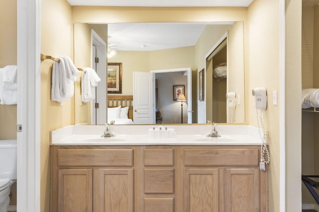 2800 Green Mountain Dr Unit 331, Branson, MO 65616 - ensuite bathroom with double vanity, toilet, and ceiling fan