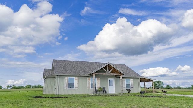 13447 E 1424th Rd, Stockton, MO 65785 - view of front of home featuring a front lawn, a carport, roof with shingles, and driveway