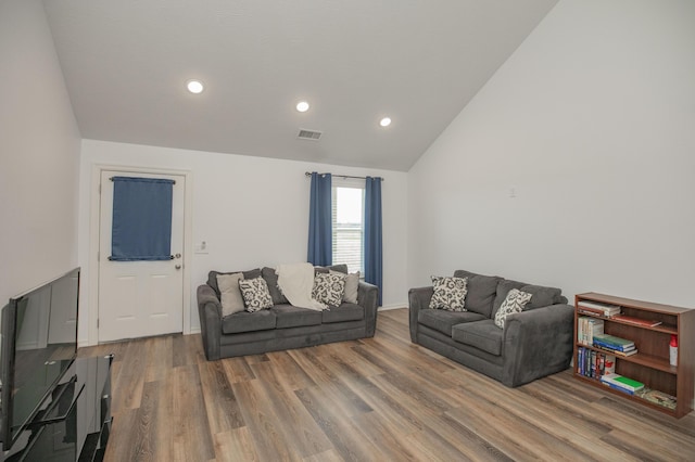 13447 E 1424th Rd, Stockton, MO 65785 - living area featuring vaulted ceiling, wood finished floors, and recessed lighting