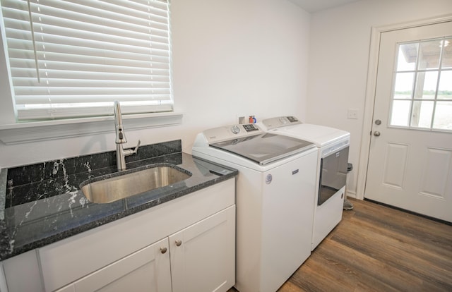 13447 E 1424th Rd, Stockton, MO 65785 - washroom featuring a sink, separate washer and dryer, and wood finished floors