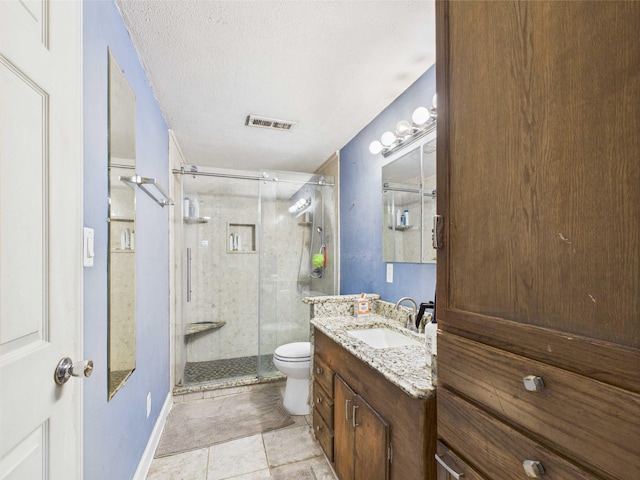 54 Southgate Dr, Harrison, AR 72601 - bathroom with vanity, toilet, a shower stall, a textured ceiling, and tile patterned floors
