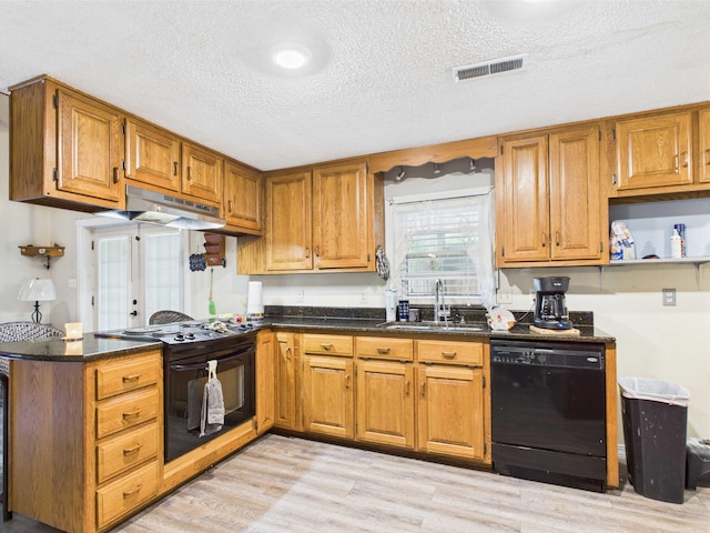 54 Southgate Dr, Harrison, AR 72601 - kitchen with black appliances, a sink, under cabinet range hood, light wood-type flooring, and brown cabinets