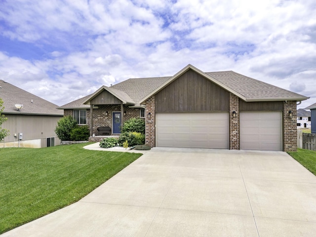 994 S Cumberland Ave, Republic, MO 65738 - view of front of home with a garage, concrete driveway, a front yard, roof with shingles, and brick siding