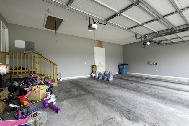 994 S Cumberland Ave, Republic, MO 65738 - garage with a garage door opener and baseboards