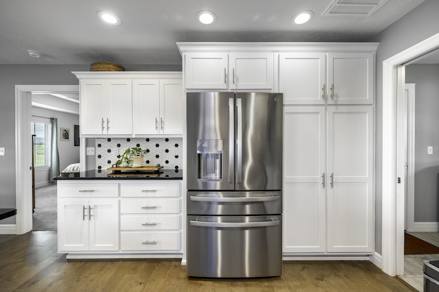 994 S Cumberland Ave, Republic, MO 65738 - kitchen featuring stainless steel fridge, white cabinets, dark countertops, dark wood-type flooring, and recessed lighting