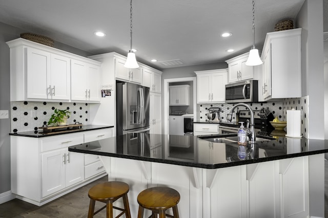 994 S Cumberland Ave, Republic, MO 65738 - kitchen with stainless steel appliances, recessed lighting, white cabinetry, and tasteful backsplash