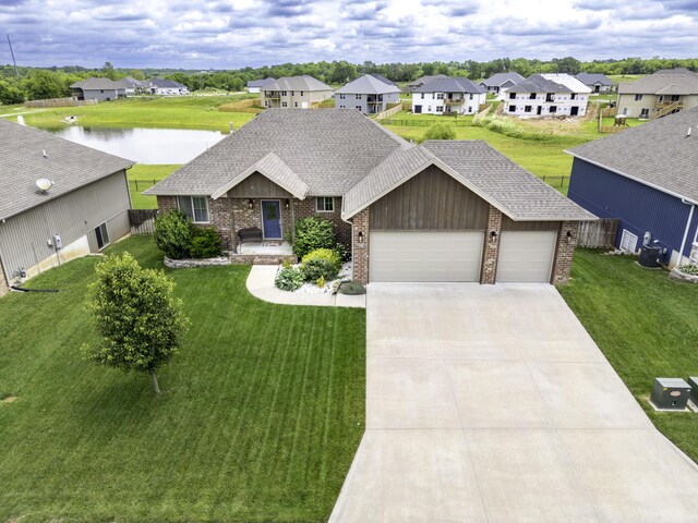 994 S Cumberland Ave, Republic, MO 65738 - ranch-style home featuring brick siding, a garage, a residential view, a water view, and concrete driveway