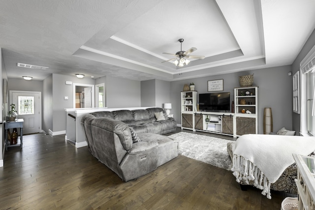 994 S Cumberland Ave, Republic, MO 65738 - living area with a raised ceiling, dark wood-style floors, baseboards, and a ceiling fan